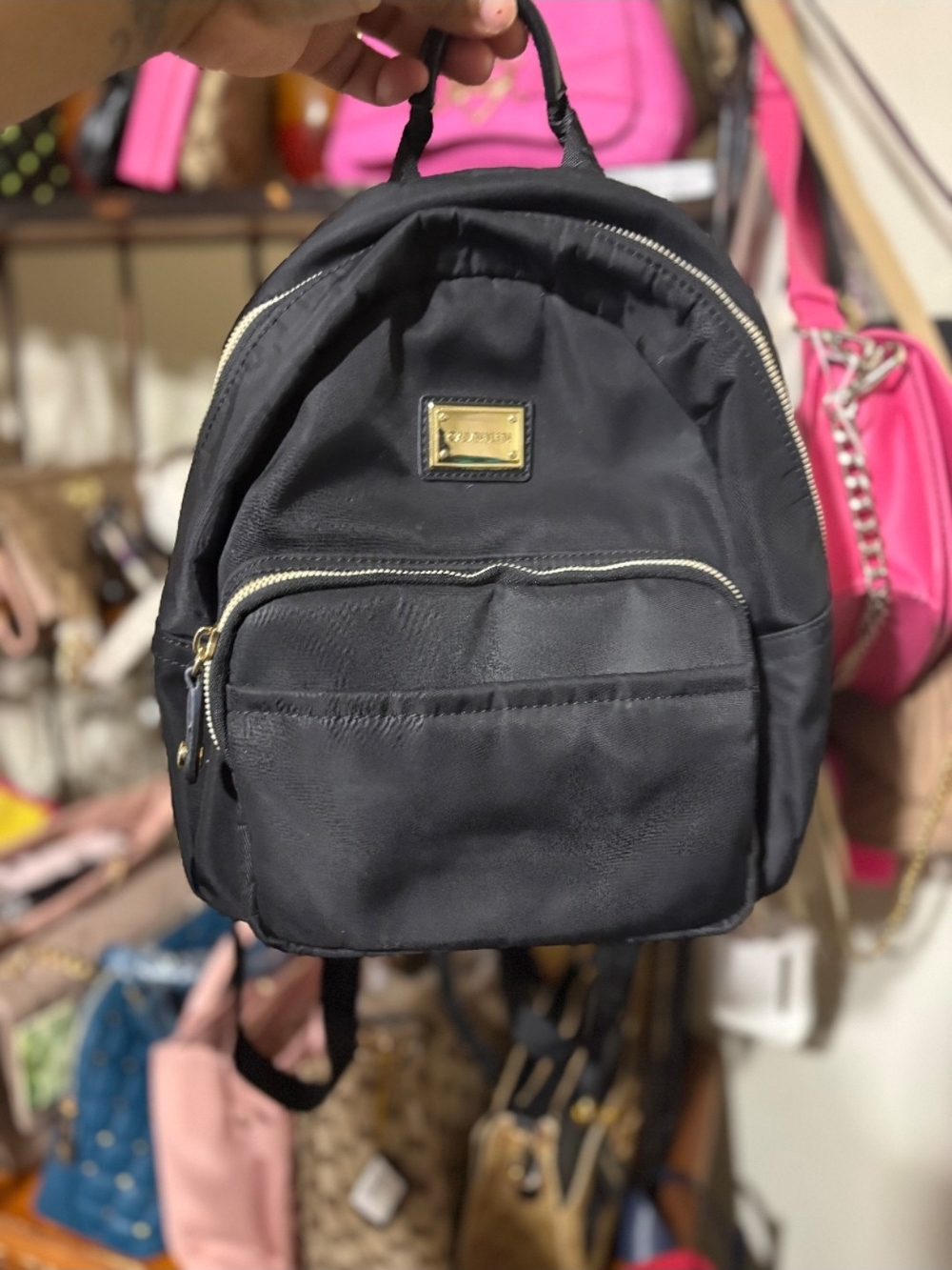 Calvin Klein Black Mini Backpack with Gold Hardware
